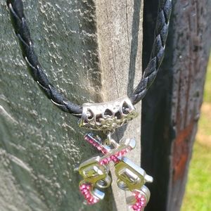 Pink, silver tone and faux leather six shooter necklace